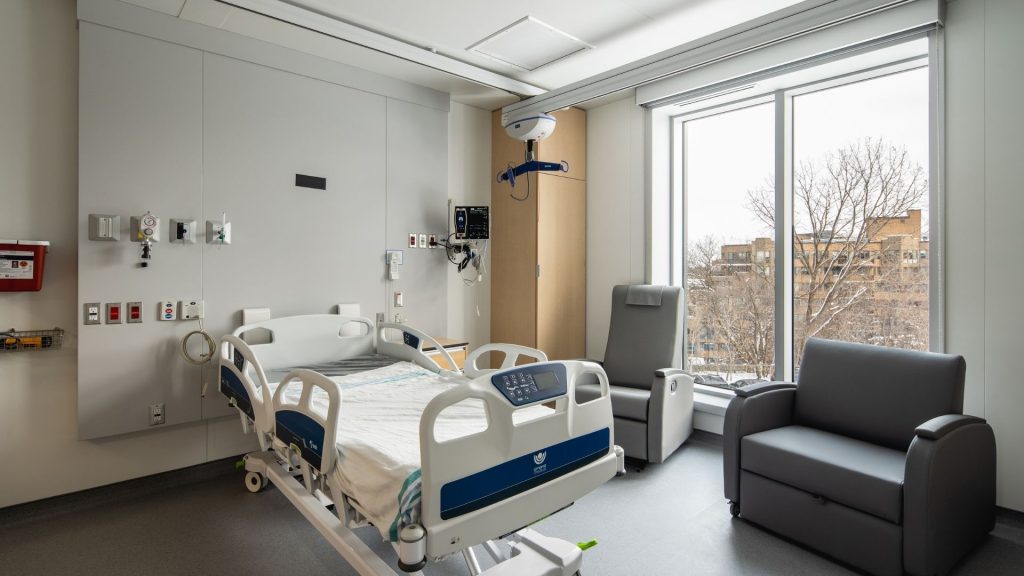 Hospital patient room with bed and medical equipment